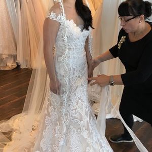 Brand new wedding dress- never worn or altered. Still in original bag.